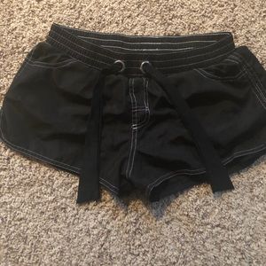 Black swim shorts, size 10